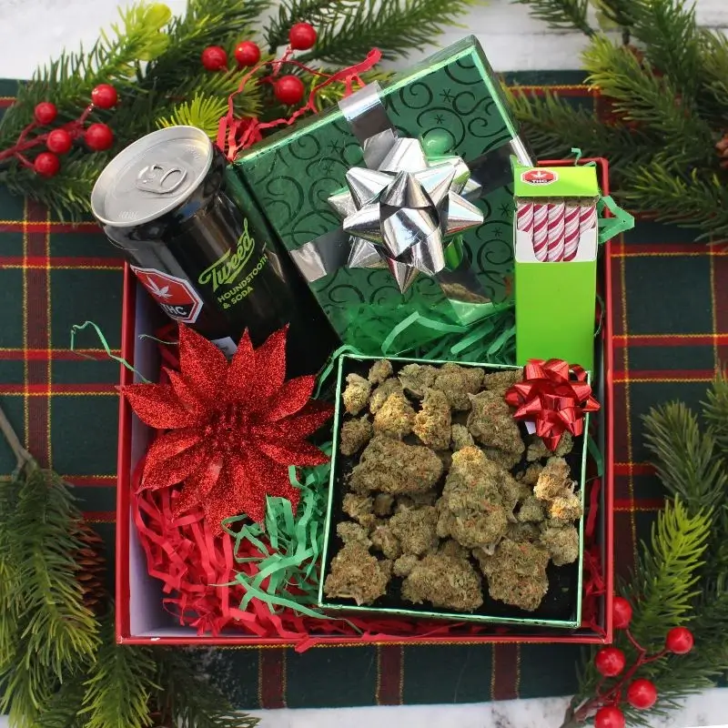 A gift wrapped cannabis mystery box, containing weed nuggets, THC-infused products, and other must-haves of life as a stoner.