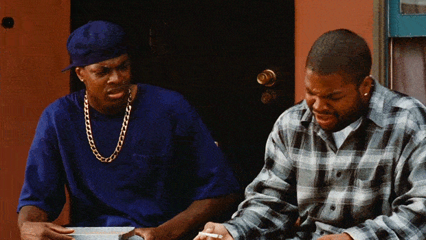 A GIF of a famous scene from the movie 'Friday' with one character getting mad at another for not adhering to the 'puff puff pass' rule of weed etiquette.