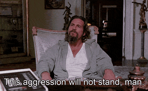 A GIF of The Dude, a famous stoner from The Big Lebowski, sitting in a chair and exclaiming 'This aggression will not stand, man.'.